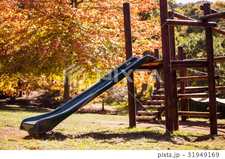 Slide at park during autumn 31949169