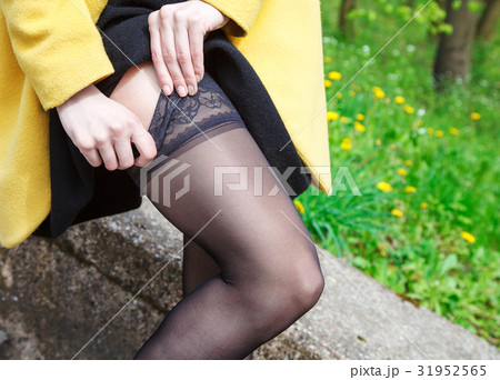 woman adjusting her stocking 31952565