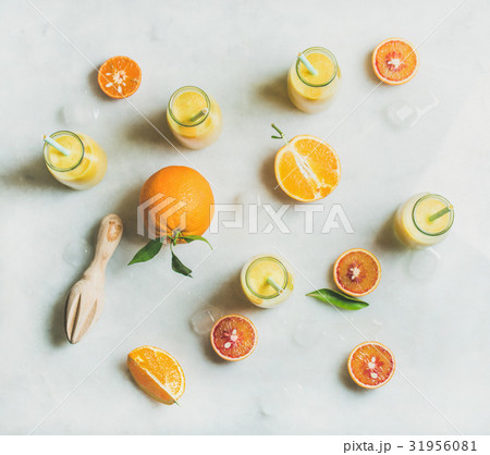 Healthy yellow smoothie with citrus fruit, ginger Healthy yellow smoothie with citrus fruit, ginger 31956081