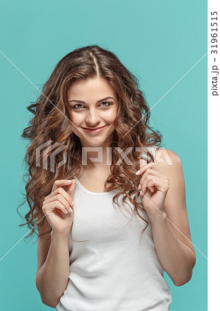 The young woman's portrait with happy emotions The young woman's portrait with happy emotions 31961515