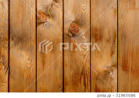 Row of tinted brown wooden boards with knots Row of tinted brown wooden boards with knots 31965086