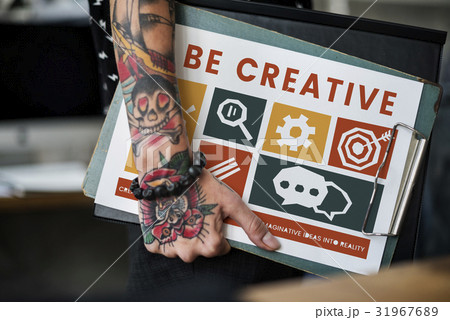 Tattooed hand with different icons on a clipboard Tattooed hand with different icons on a clipboard 31967689