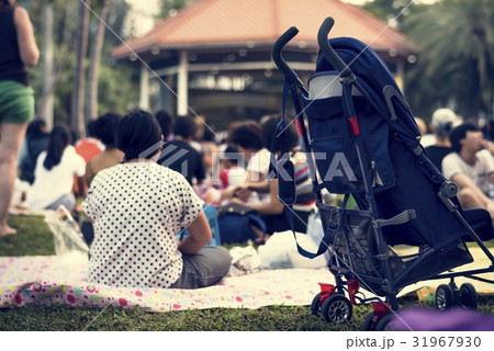 People Crowded Sitting Picnic in The Park 31967930