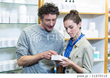 Couple checking medicines Couple checking medicines 31970518