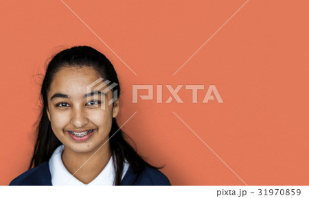 Portrait studio shoot of schoolgirl in uniform with smiling Portrait studio shoot of schoolgirl in uniform with smiling 31970859