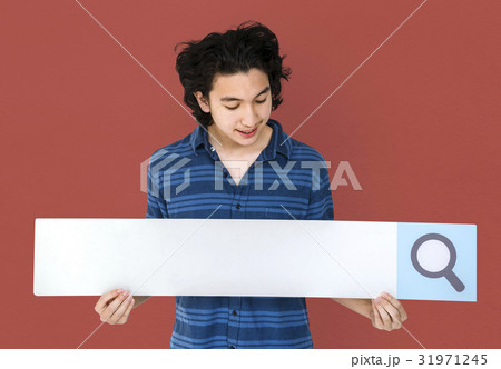Young adult asian man holding blank searching banner Young adult asian man holding blank searching banner 31971245