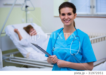 Nurse holding a clipboard 31972051