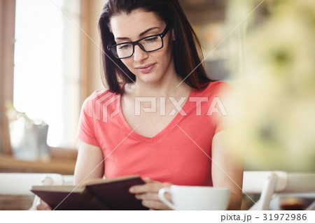 Beautiful woman reading a book 31972986