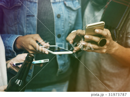 Group of friends share networking with smart phone 31973787