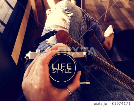 Traveler woman sitting holding camera 31974171