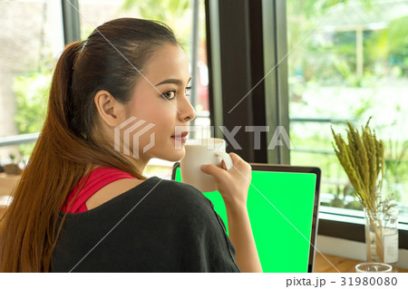 Young businesswoman using tablet computer Young businesswoman using tablet computer 31980080