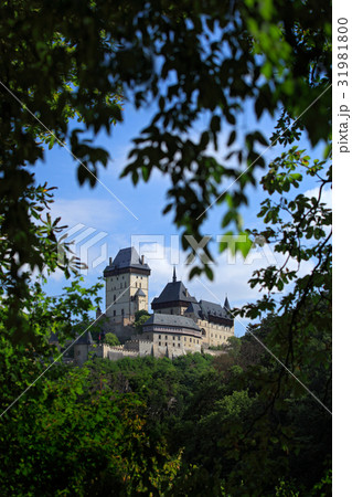 Gothic royal castle Karlstejn in green forest 31981800