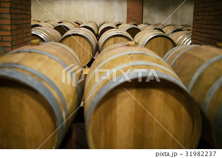 Rows of wooden wine barrels Rows of wooden wine barrels 31982237