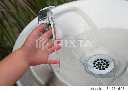 children wash hand touching tap water fountain children wash hand touching tap water fountain 31984603