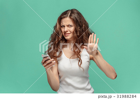 The portrait of disgusted woman with mobile phone 31988284