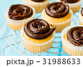 Mini sweet cupcakes with chocolate ganache 31988633