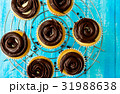 Tasty cupcakes on the blue background 31988638