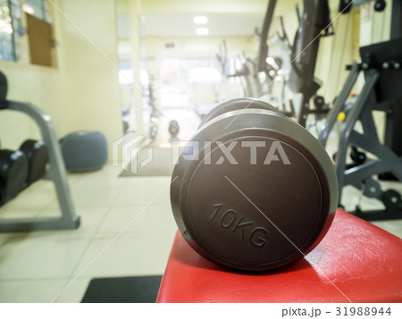 Sports dumbbells in modern sports club. 31988944