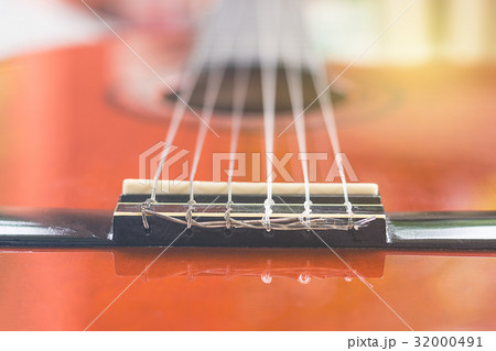 close-up of classical guitar bridge close-up of classical guitar bridge 32000491