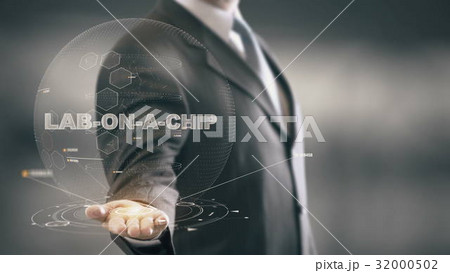 Lab-on-a-chip with hologram businessman concept Lab-on-a-chip with hologram businessman concept 32000502