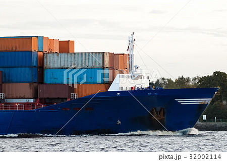 Blue container ship's bow 32002114
