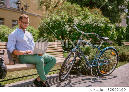 Concentrated casual businessman working with 32002160