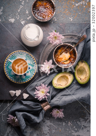 Still life with Catalan cream , avocado and cup of 32002397