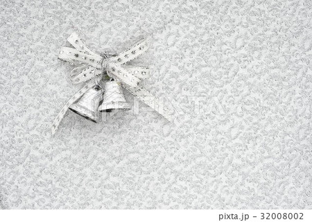 silver jingle bells on a silver background 32008002