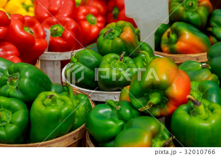 Fresh ripe red sweet bell pepper in box on sale Fresh ripe red sweet bell pepper in box on sale 32010766