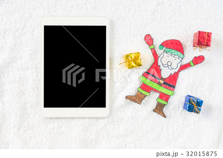 Santa Claus with gifts and Tablet  32015875