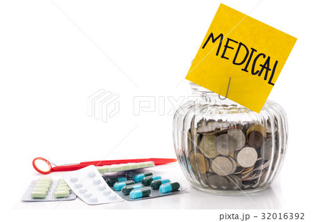 Coins in glass bottle with medicine  32016392