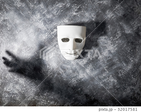 White mask with shadow of hand White mask with shadow of hand 32017581