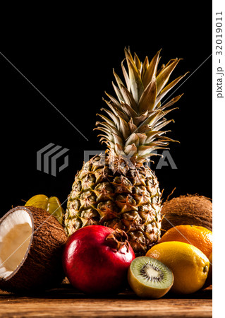 Super tasty tropical fruits on wooden table 32019011