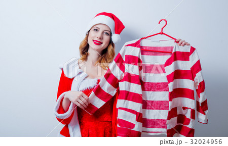 Santa Clous girl in red clothes with shirt 32024956