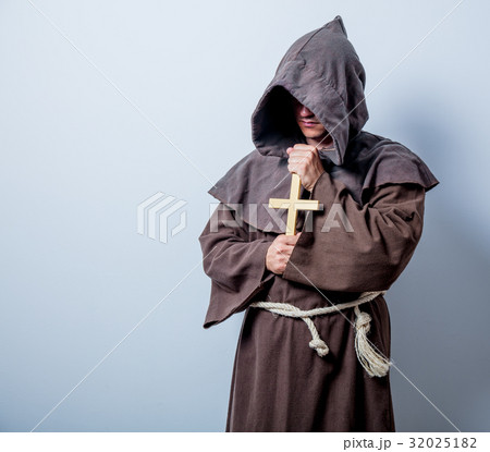 Portrait of Young catholic monk with cross 32025182