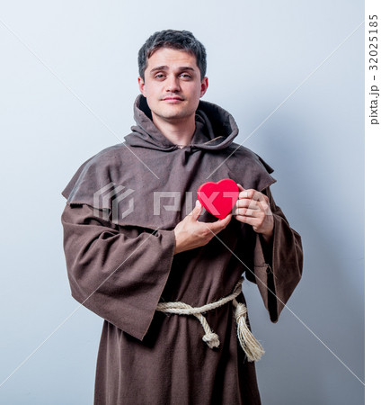 Portrait of Young catholic monk with heart shape Portrait of Young catholic monk with heart shape 32025185