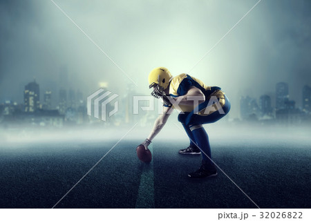American football player, cityscape on background 32026822