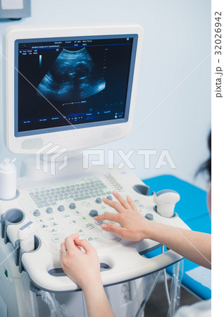 Hands on an ultrasound machine at modern clinic Hands on an ultrasound machine at modern clinic 32026942