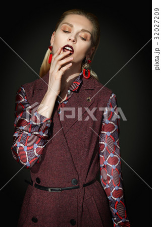 fashion model touching her lips with fingers 32027209