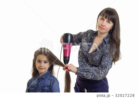 young woman dries hair cute little girl isolated 32027228