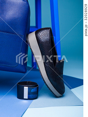 Blue color fashion style still life setup on blue Blue color fashion style still life setup on blue 32028929