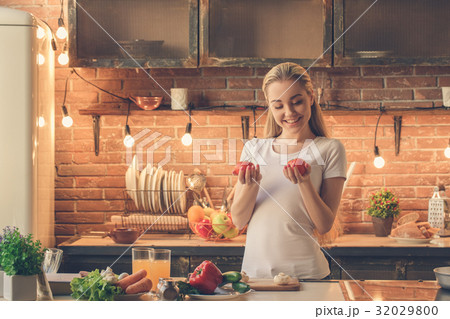 Young woman cooking healthy fresh meal at home Young woman cooking healthy fresh meal at home 32029800