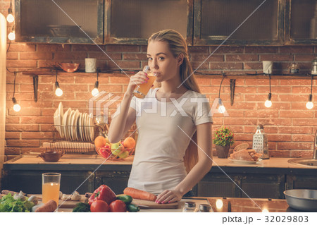 Young woman cooking healthy fresh meal at home Young woman cooking healthy fresh meal at home 32029803