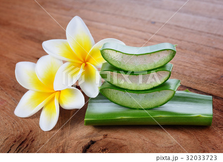 Aloe vera and frangipani flower on wooden 32033723