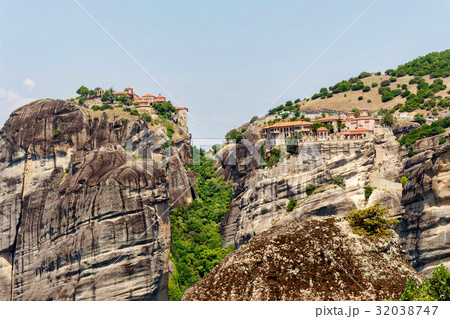 Aerial sunset view to two monasteries at coast of mountains 32038747