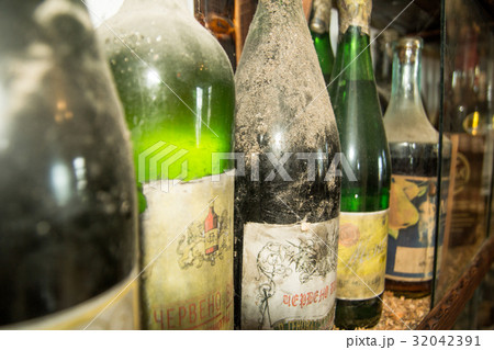 Old bottles of wine in old cellar Old bottles of wine in old cellar 32042391