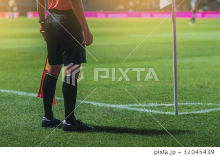 Lineman referee at the corner of a soccer field. Lineman referee at the corner of a soccer field. 32045439