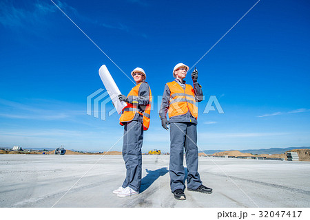 two engineers at airport runway two engineers at airport runway 32047417