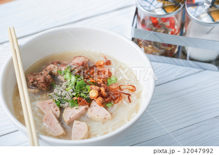 Vietnamese noodle soup on white wooden table. Vietnamese noodle soup on white wooden table. 32047992