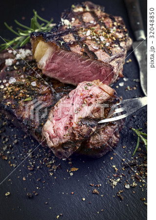 Barbecue Rib Eye Steak on Slate Slab Barbecue Rib Eye Steak on Slate Slab 32048850